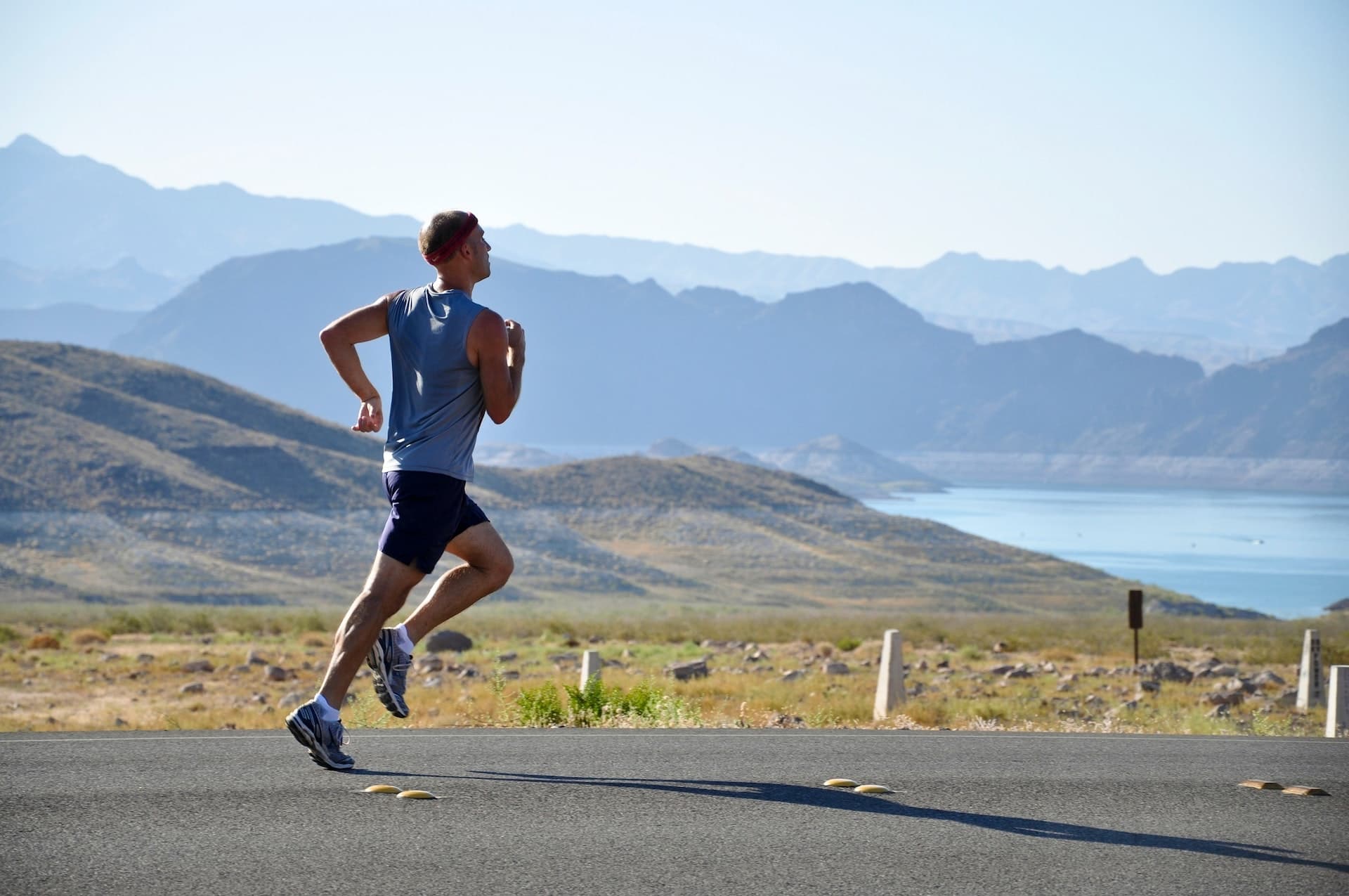 Runner training on an open road